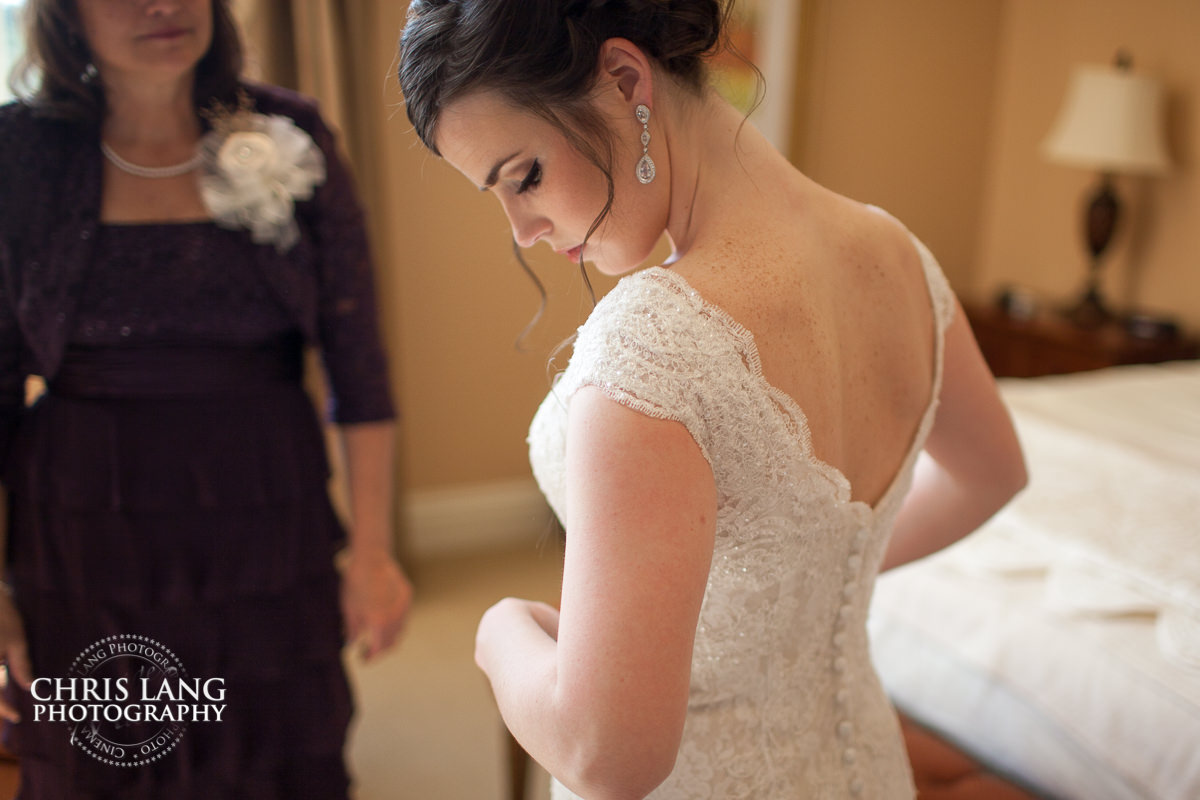 bride putting on her wedding dress - river landing weddings - pre wedding photos - wedding photo ideas - getting ready wedding pictures - bride - groom - wedding dress - wedding detail photos - river landing wedding photography