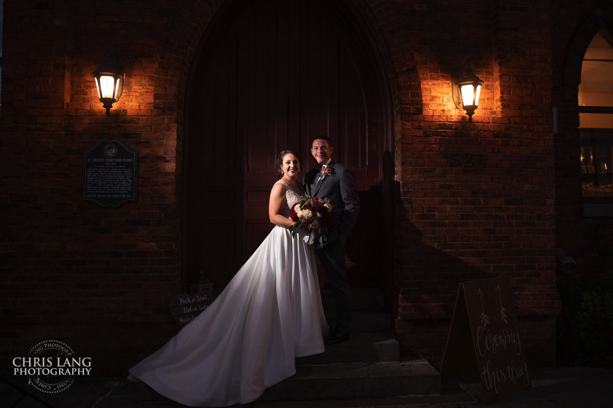 bride and groom in front of bac - night wedding image - brooklyn arts center - weddings - wedding venue -  wedding photo - bride - groom - ideas - wilmington nc - chris lang photography - 