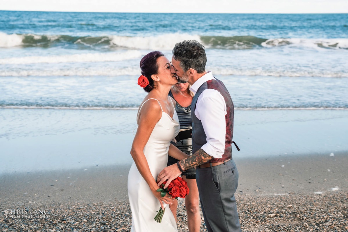 Fort Fisher Wedding Photographers - Ft Fisher Wedding Photography  - Bride and groom first kiss - beach wedding at   Fort Fisher North Carolina -  Wedding Photography - Wedding Ideas - Bride - Groom - Wedding Dress - Chris Lang Photography- Popular wedding location - 