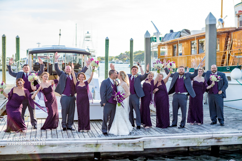 Bluewater grill wedding - bridal party posing fpor wedding picture in fron og bluewatergrill in wrightsville beach