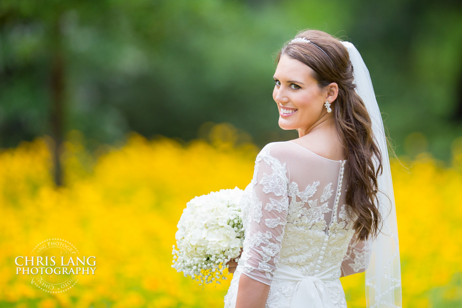 Airlie Gardens Bridal Photo - Bride inf ield of yellow flowers - bridal portrait photography - bridal portraits - bride - wedding dress - ideas - wilmington nc -