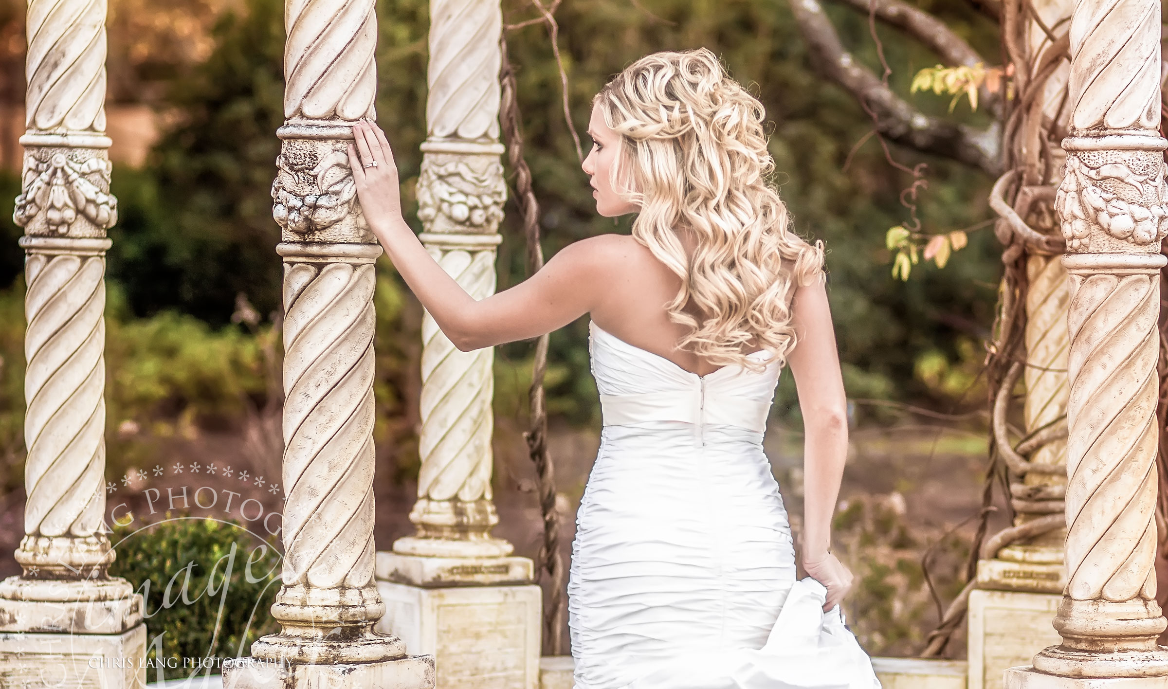 Bridal picture of a stunning bride in her wedding dress at the Arboretum in Wilmington NC Photographer