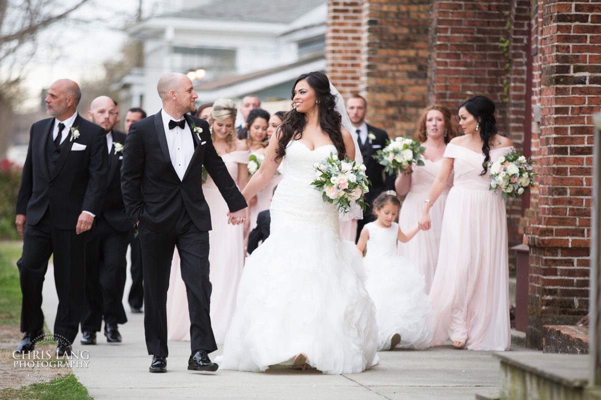 Bride and groom walking with bridal  party - brooklyn arts center - weddings - wedding venue -  wedding photo - ideas - wilmington nc - chris lang photography 