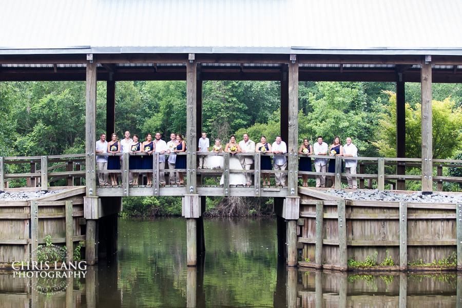Image of bridal party on the covered bridge at River Landing, Wallace NC