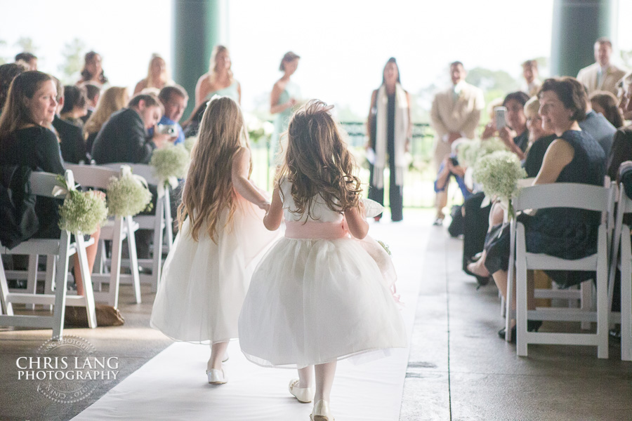 Flower Girls walking down the isle - Weddings on the Vernada at River Landing Country club - Wedding Photography