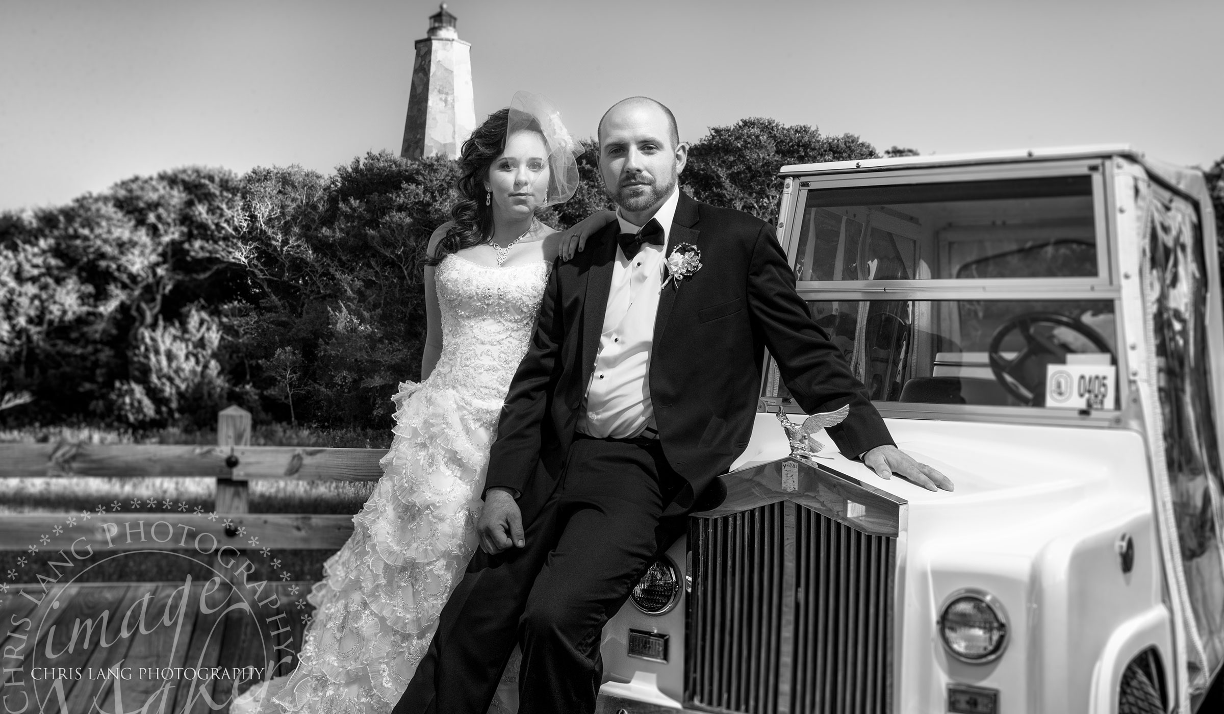 Picture of a bride and groom posing in front of a golf cart on Bald Head Island. Bald Head Island Wedding Photographers
