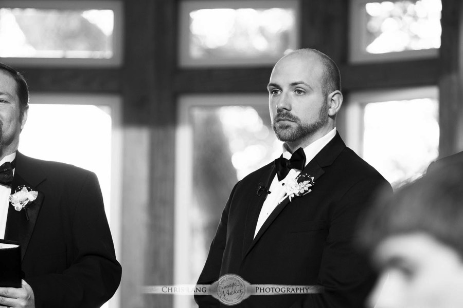 Real Weddings-Featured Wedding in Black and White-Wedding Ideas-Style-Trends-Wilmington NC Wedding Photographers-groom looking at his bride walking down the isle