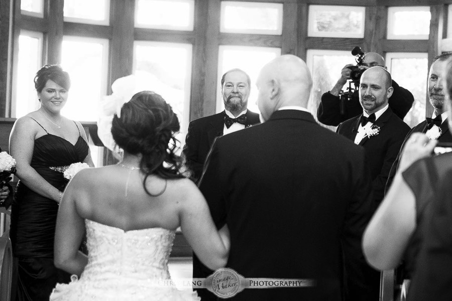 Real Weddings-Featured Wedding in Black and White-Wedding Ideas-Style-Trends-Wilmington NC Wedding Photographers-Bride being escorted down the isle-Bald head Island Village Chapel