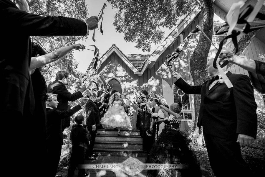 Real Weddings-Featured Wedding in Black and White-Wedding Ideas-Style-Trends-Wilmington NC Wedding Photographers-Bride-Groom-exiting the wedding chapel