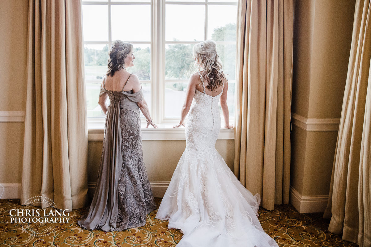 mother of bride and bride sharing a moment before the wedding - river landing wedding photography - pre wedding photos - wedding photo ideas - getting ready wedding pictures - bride - groom - wedding dress - wedding detail photos - river landing weddings