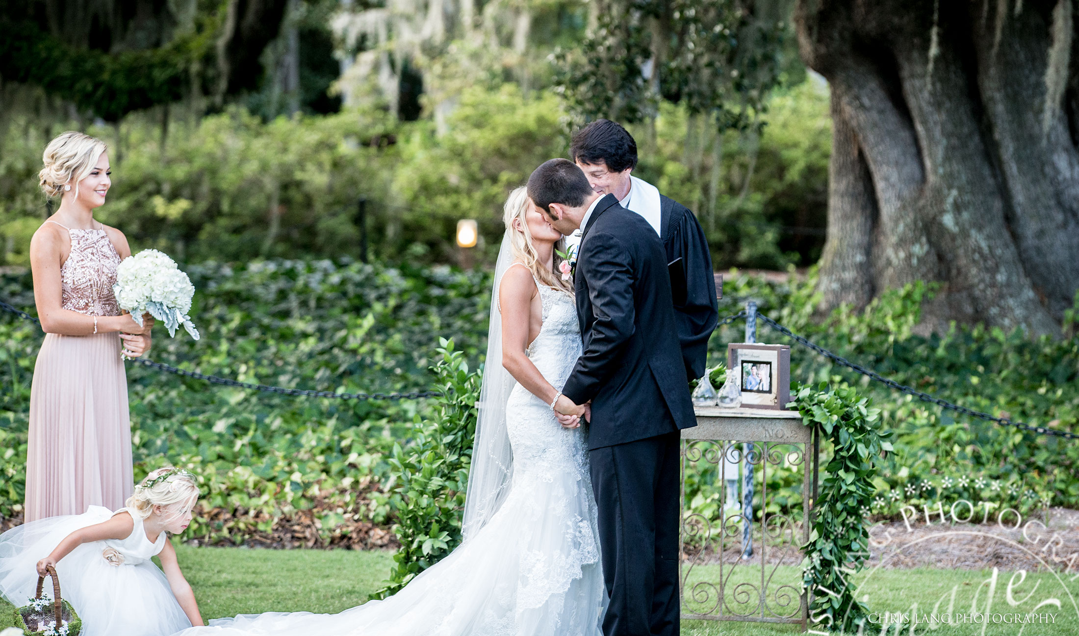 wedding ceremony at Airlie Gardens - Wilmington NC - wedding photography - the first kiss - wedding photography - lifestyle weddings