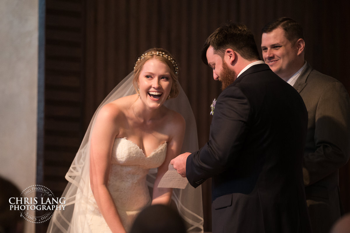 Bride & Groom at the alter laughing -  Wilmingot NC Wedding Photographers