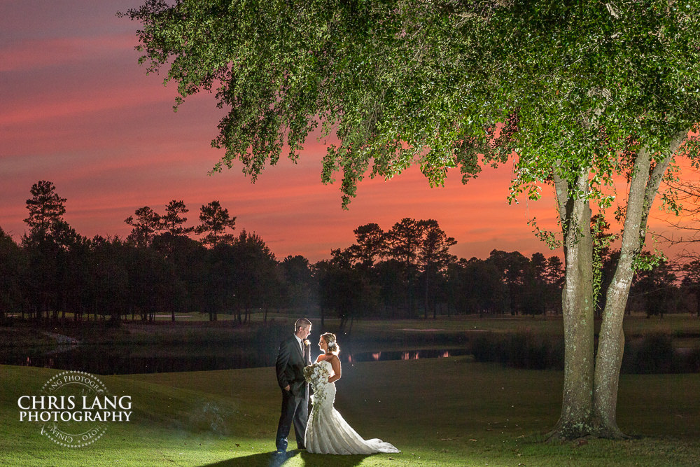 wilmington nc wedding photographers - bride and groom -sunset wedding photo - the golden hour - bride & groom - wedding dress - sunset wedding photography - twlight 