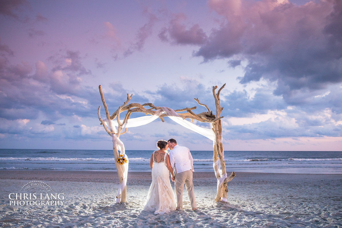 Ocean Isle Beach Weddings NC - destination weddings - beach weddings - sunset wedding photo - the golden hour - bride & groom - wedding dress - sunset wedding photography - twlight on the beach