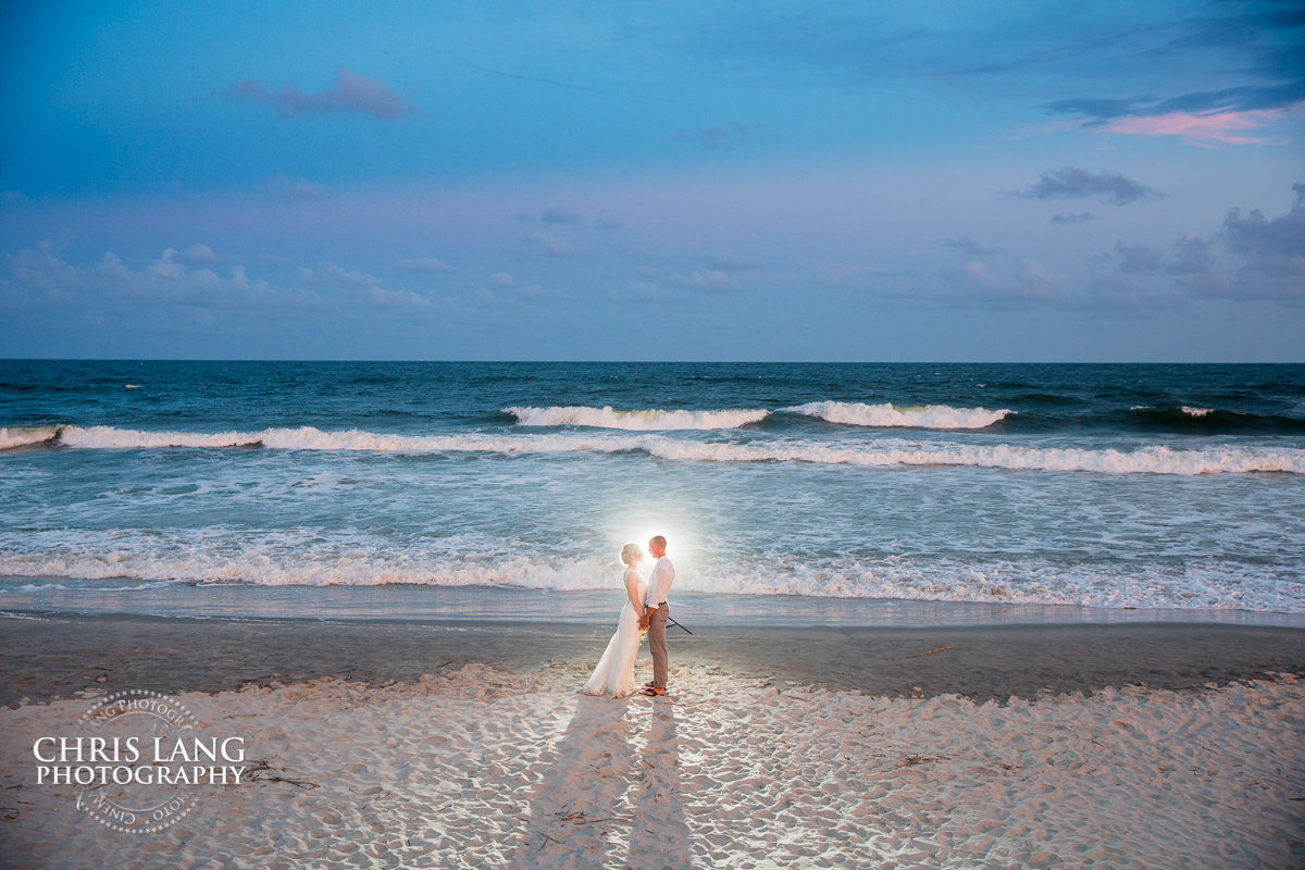 ocean isle beach weddings - beach weddings - sunset wedding photo - the golden hour - bride & groom - wedding dress - sunset wedding photography - twlight on the beach - destination weddings