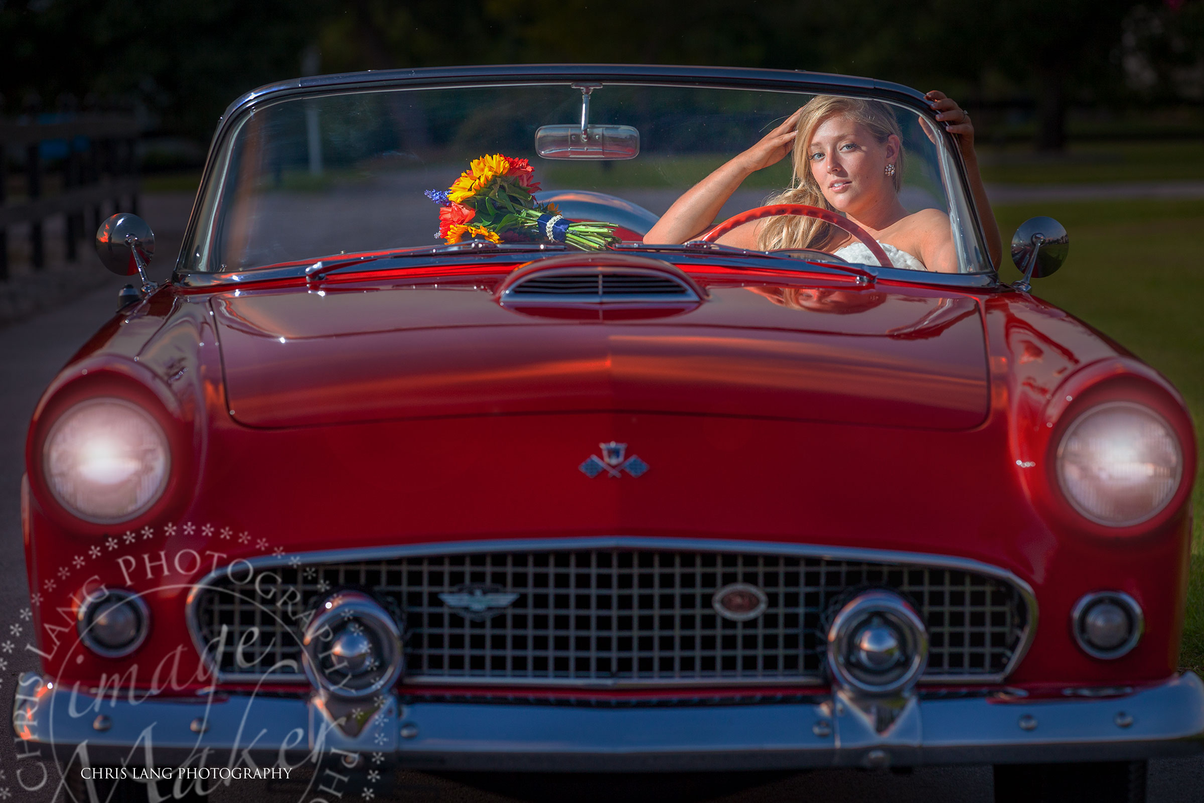 Image of Bride in her wedding dress ina red ford thunderbird convertable - Birdal Photography Ideas - Wilmington NC Photographers
