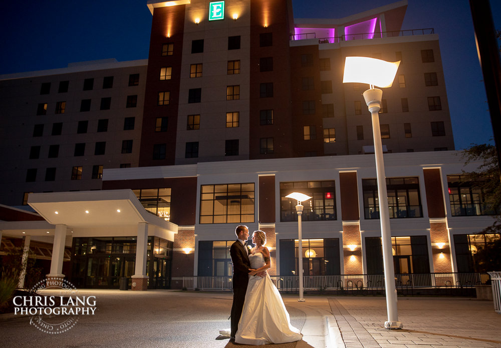 Embassy Suites by Hilton in WIlmington NC - Bride & Groom wedding image at sunset in front of the hotel - wedding dress - Embassy Suites Weddings - wedding venue 