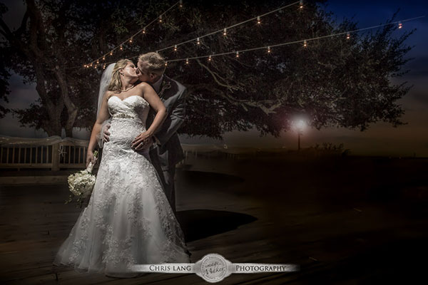 A wedding image of a bride and groom on the beach at Shell Island Resort enjoying the beach during sunset. Wilmingotn Wedding Photographer