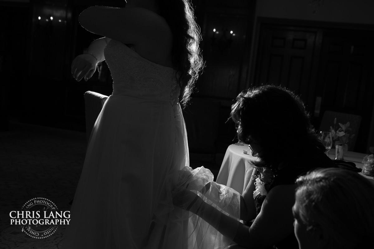 bride in wedding dress - final touches -pre wedding photos - wedding photo ideas - getting ready wedding pictures - bride - groom - wedding dress - wilmington nc wedding photography  