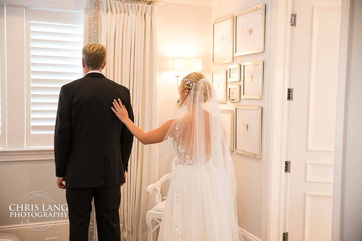 Father daughter forst look in her wedding dress - wilmington wedding photography - pre wedding photos - wedding photo ideas - getting ready wedding pictures - bride - groom - wedding dress - wedding detail photos - wilmington nc wedding photographers