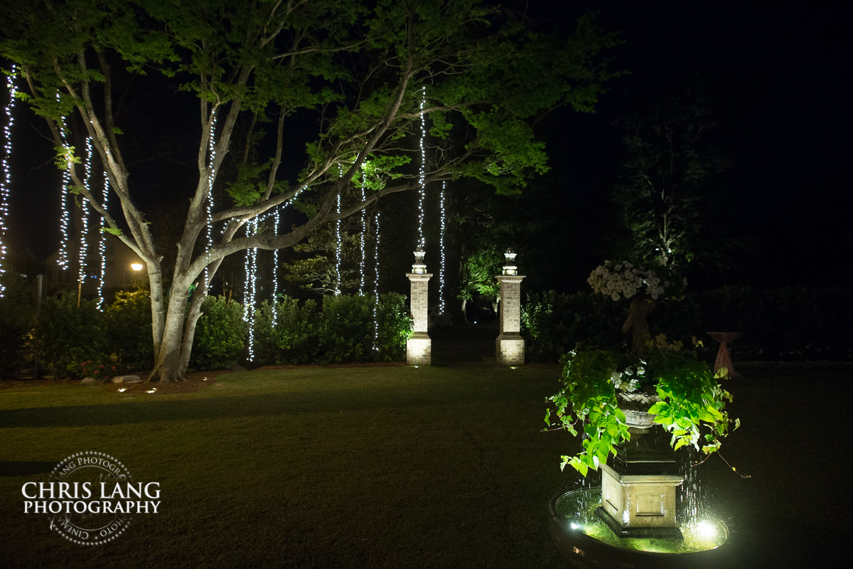 Lights hanging from giant oak tree in front of Wrightsville Manor  during a wedding reception - Wilmington NC wedding venues 